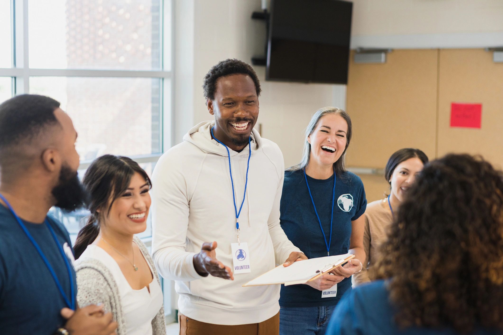Diverse volunteers smiling together during a training session
