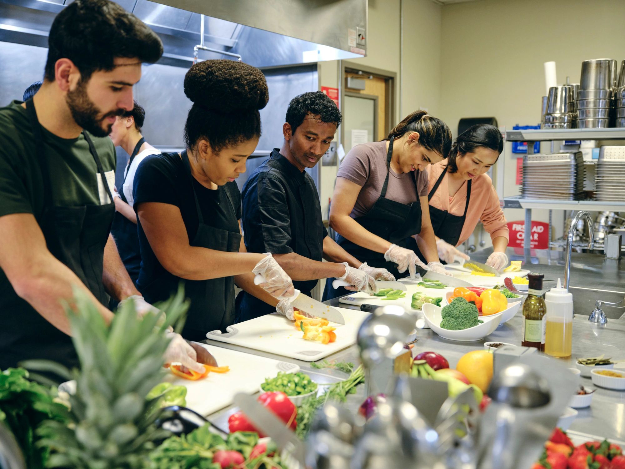 Teaching chef working with a group during a nutrition class