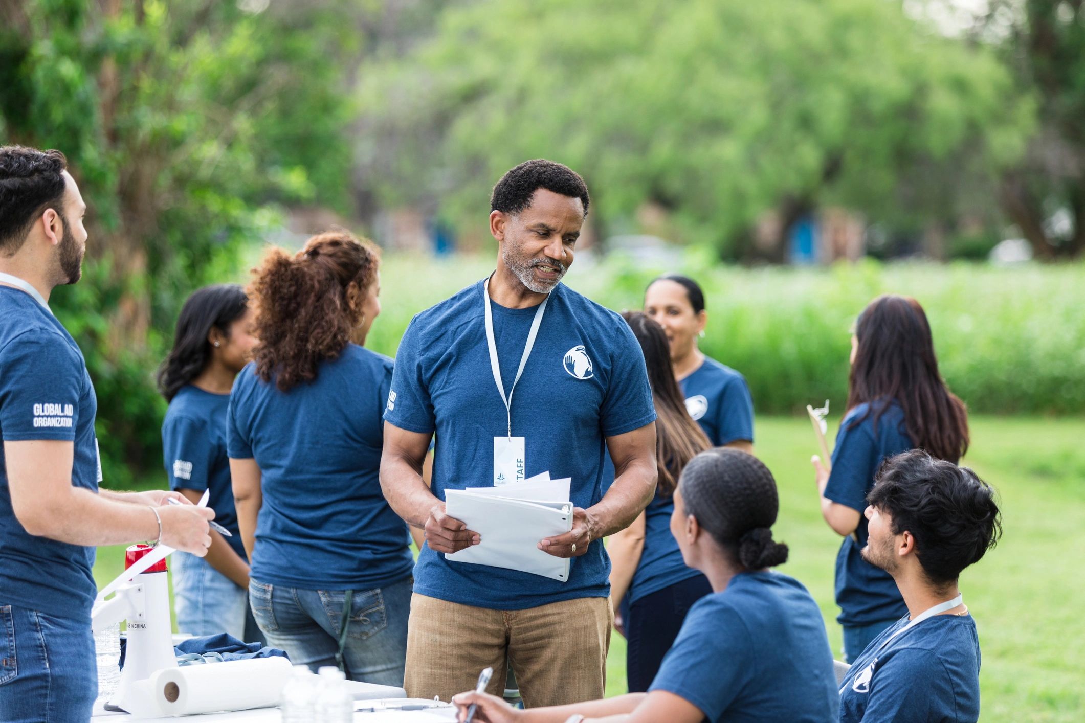 Volunteer team planning roles for a community outreach event