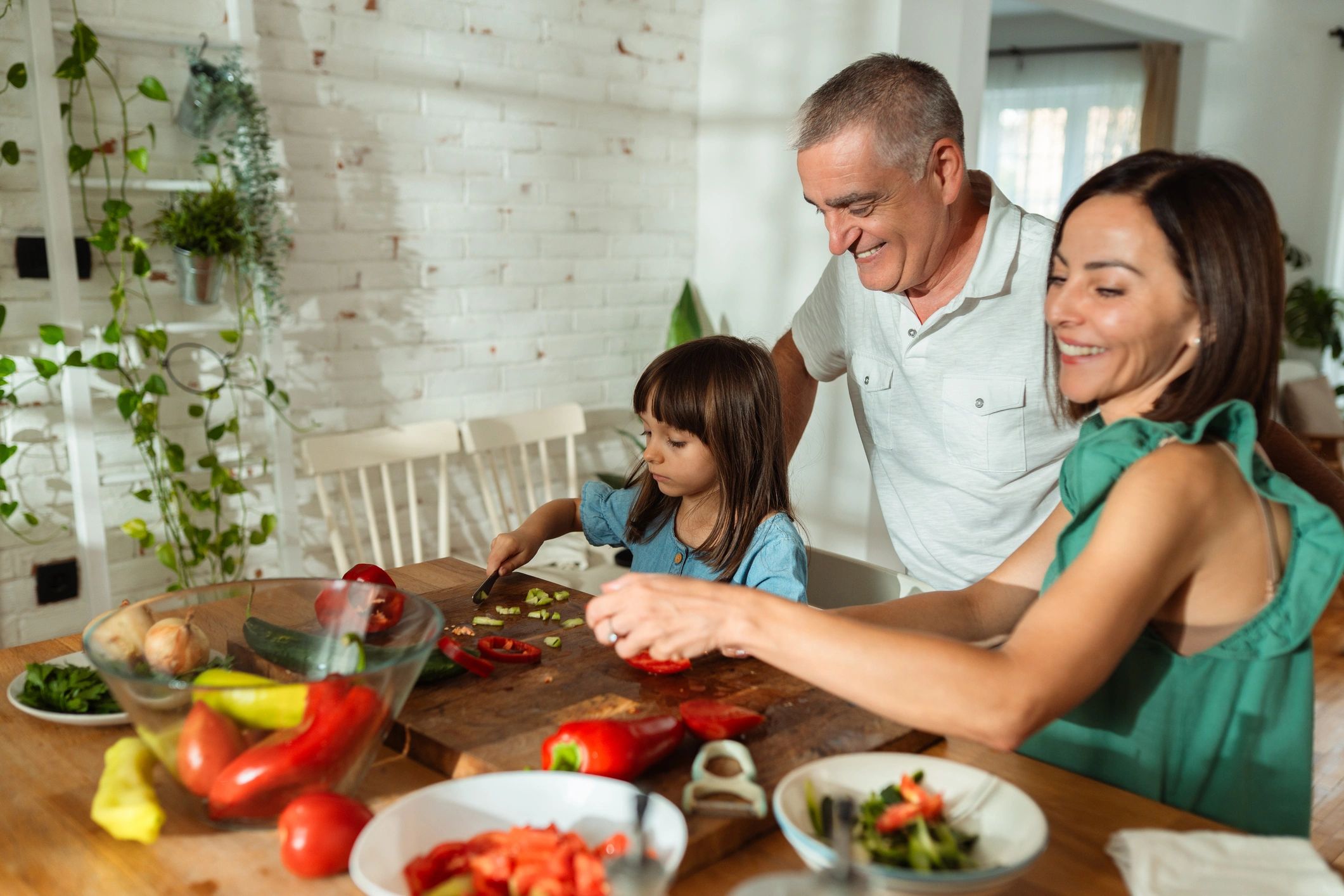 Family preparing a healthy meal together in a kitchen